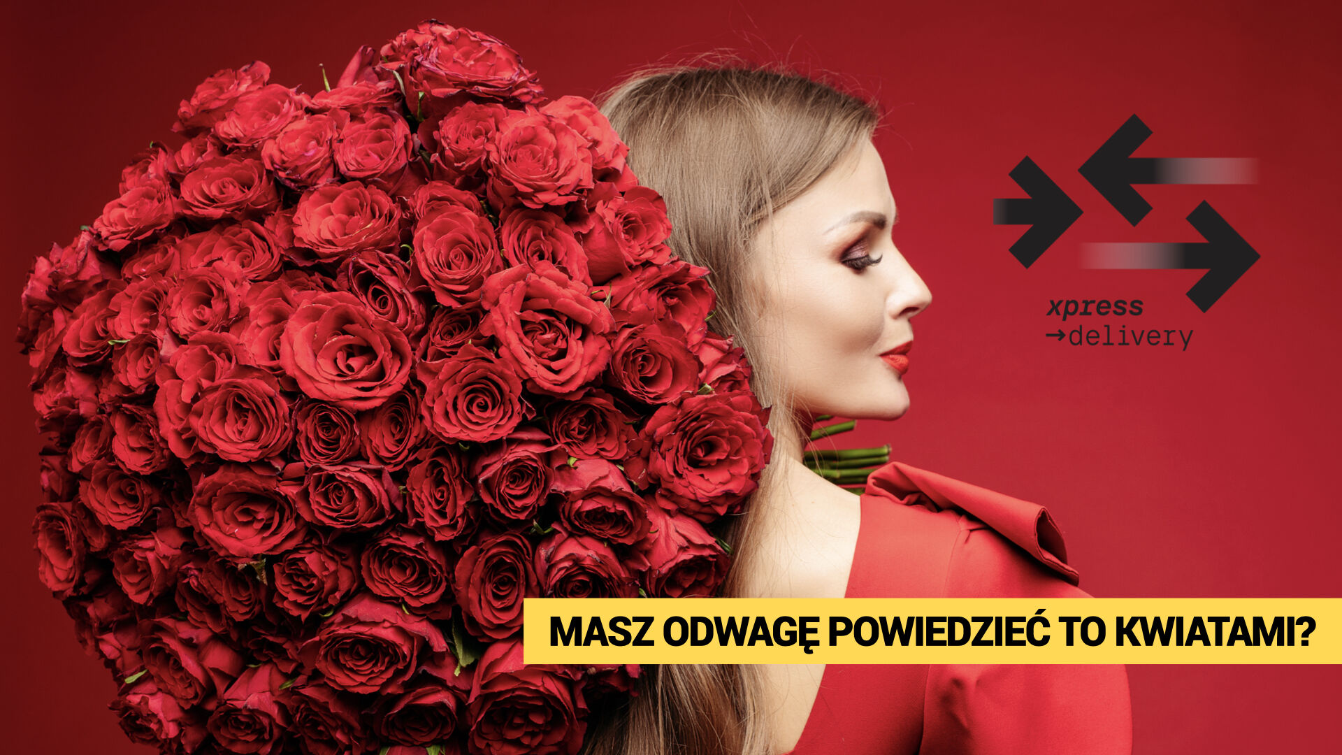 Kobieta z ogromnym bukietem czerwonych róż – ekspresowa dostawa kwiatów w 2 godziny z Xpress Delivery. Hasło: „Masz odwagę powiedzieć to kwiatami?”